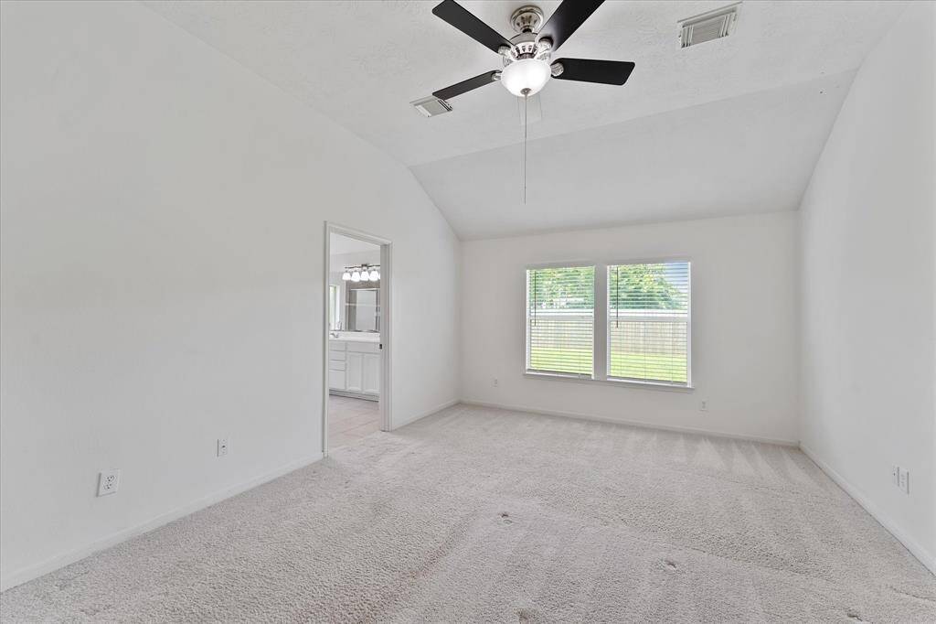 Primary suite is a generous size for a king bed.