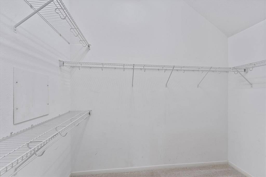 Walk in closet in the primary suite.