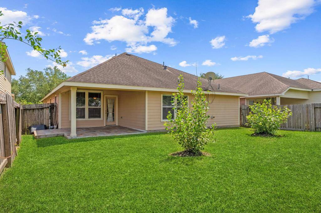 Covered back patio with tile will provide great shade during the summer months.