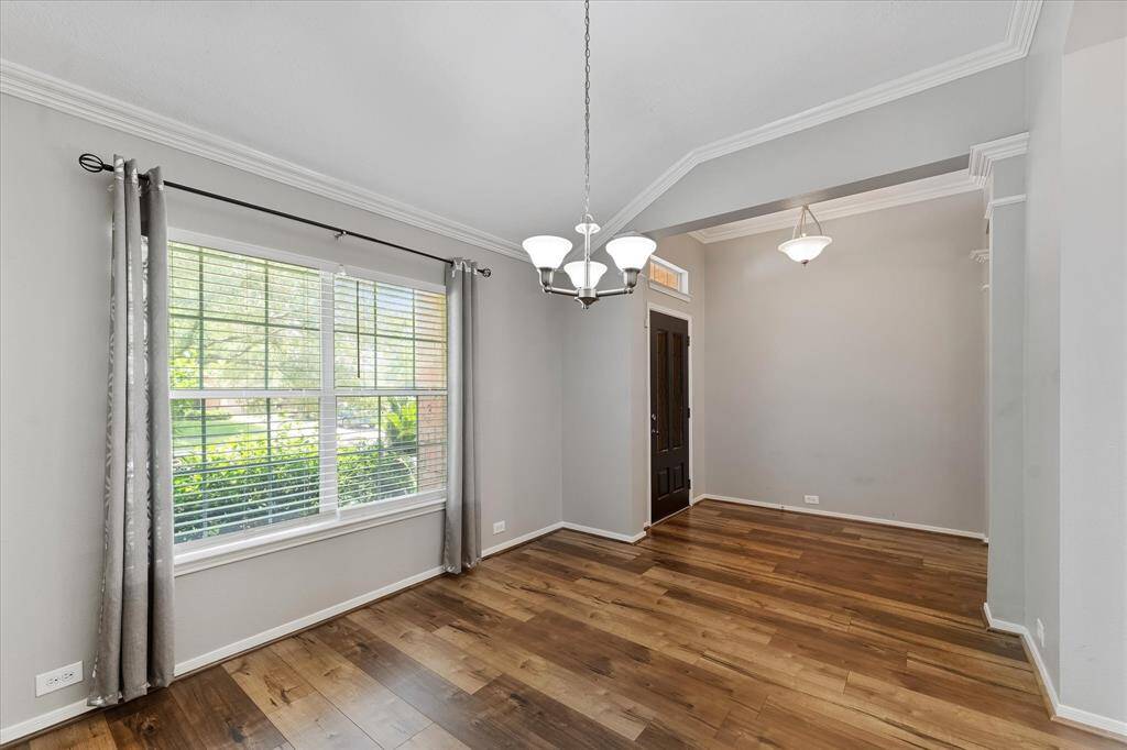 Spacious room off the entry can be a formal dining, office or study.