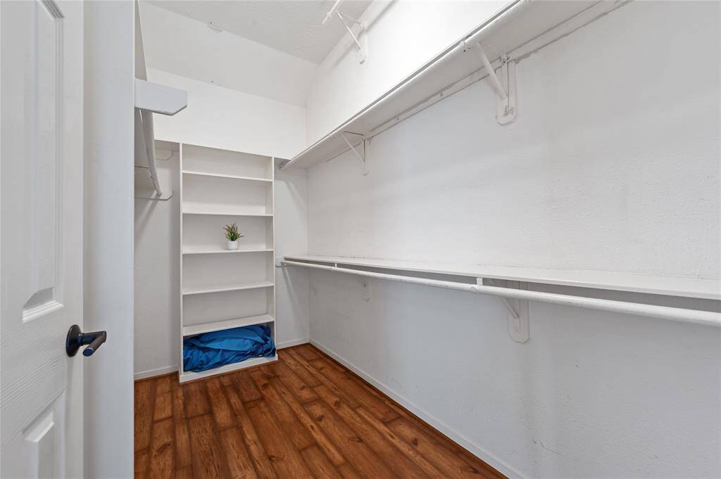Huge primary bedroom on the first floor with an extra sitting area overlooking your backyard oasis.
