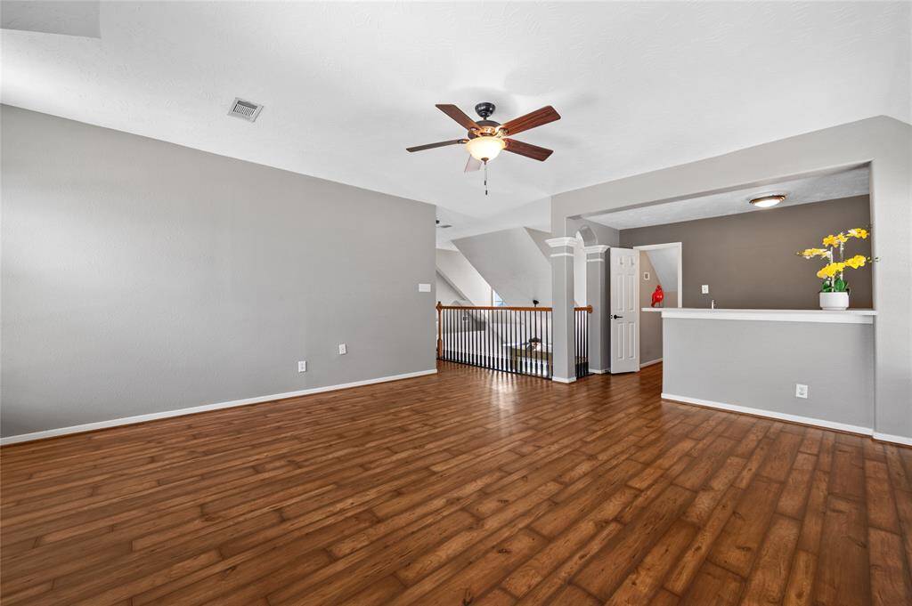 At the end of the hallway is this huge game room with wet bar and a full bathroom.