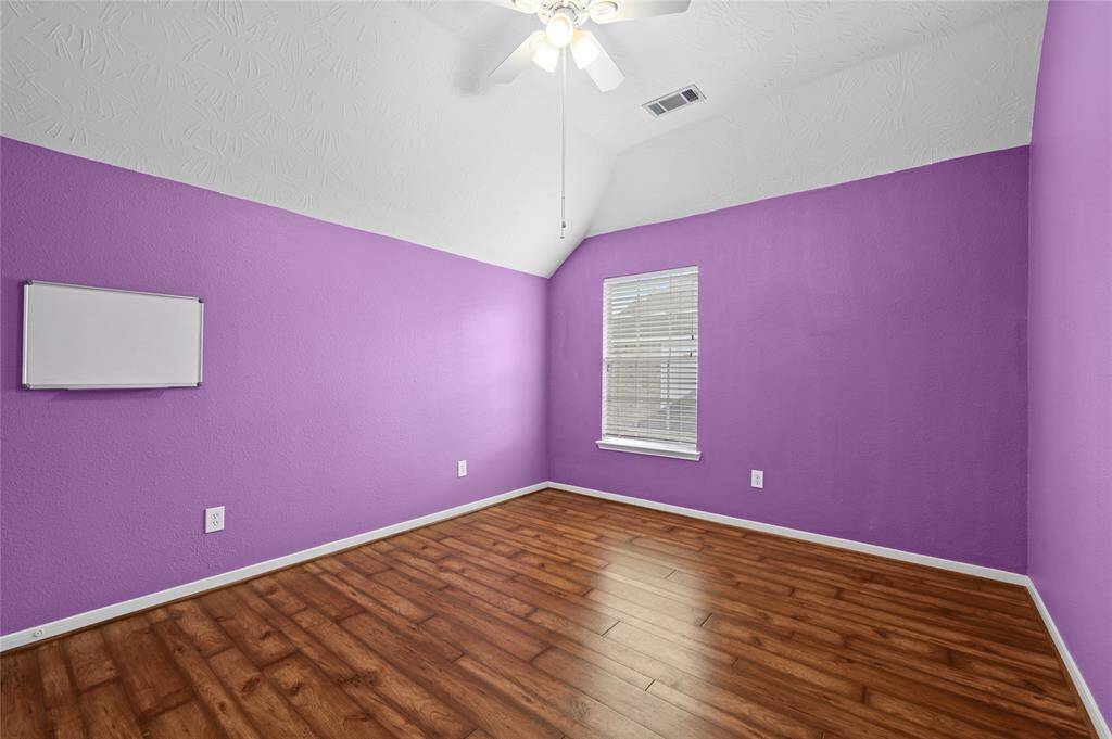 Secondary bedroom upstairs with beautiful natural light and a great sized closet.