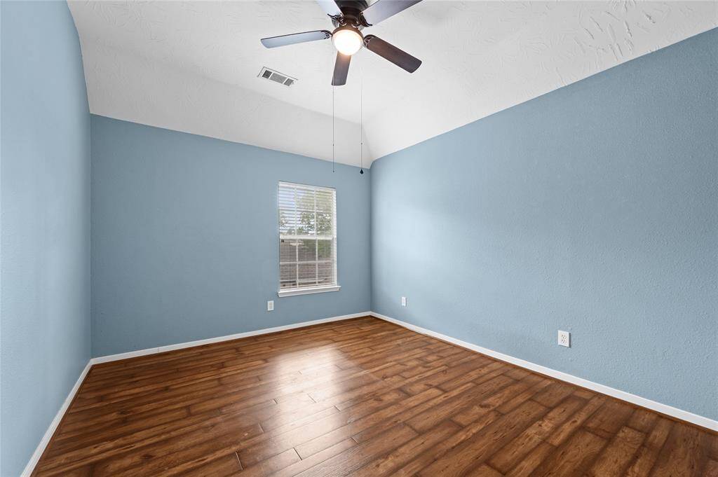 Another large secondary bedroom upstairs.