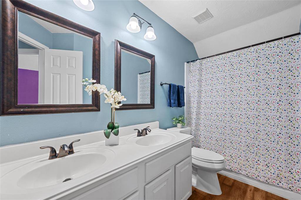 This is secondary bedroom #3 upstairs. High ceilings, easy up-keep LVP flooring