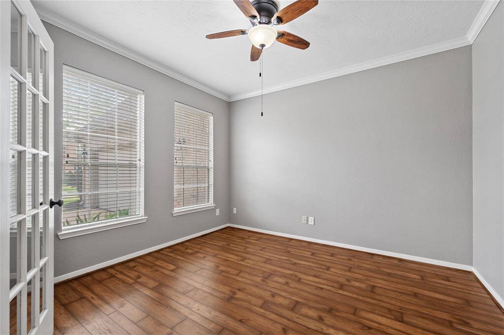 Another view of the entry from the family room; LVP flooring throughout the home. No carpet!