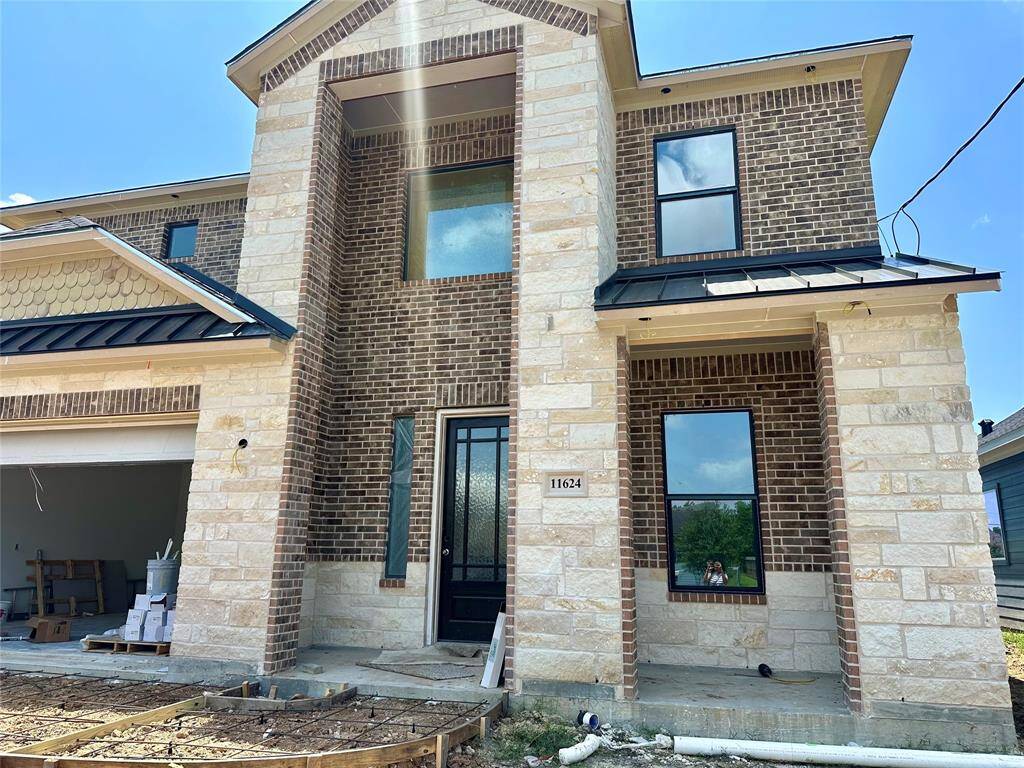 Features a covered front porch and as you walk into the home, you will see an impressive 8-foot solid wood front door.