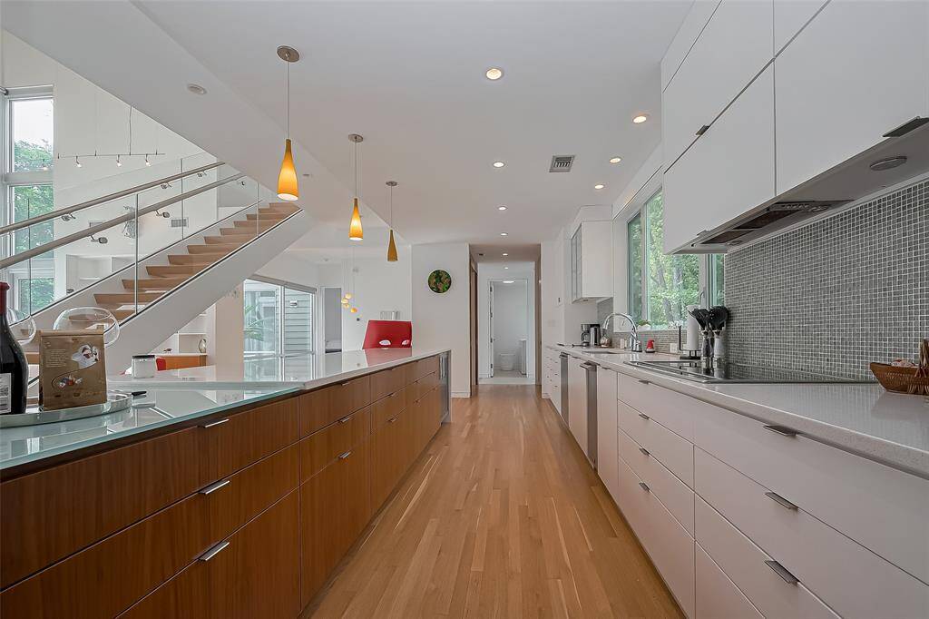 Minimalist design flows seamlessly into the formal dining area, perfect for entertaining.