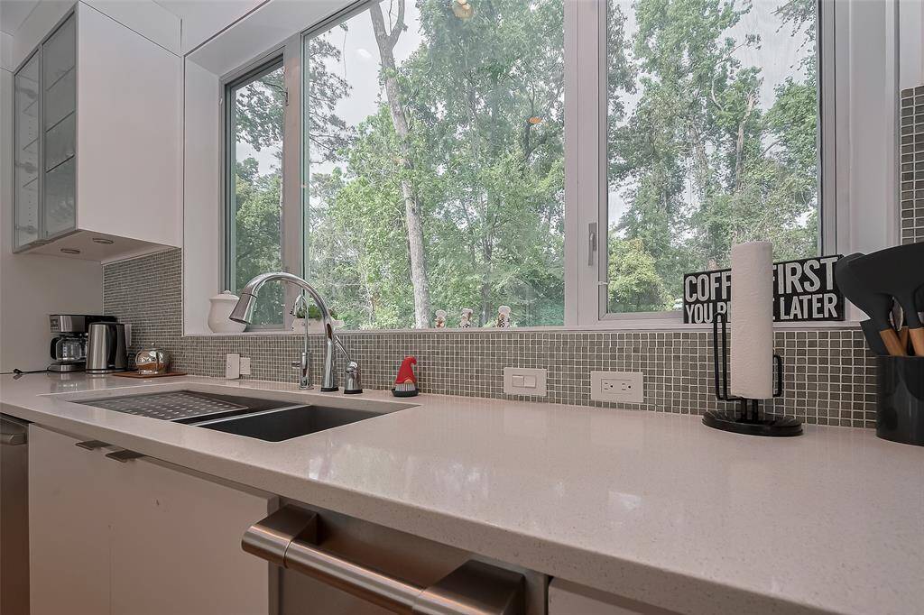 Elegant induction cooktop with sleek vent hood and ample prep space in a chef-inspired kitchen.