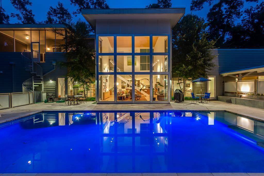 Step inside 118 Angel Leaf Road, where architectural elegance meets peaceful nature. This fully furnished, design-forward home features a soaring glass façade, stunning two-story living area, and a freshly replastered 25,000-gallon pool glowing beautifully at night. Tucked next to a serene preserve, this is indoor-outdoor living at its finest.
