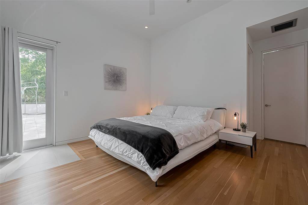 Access to private patio and ensuite bath from this serene suite.