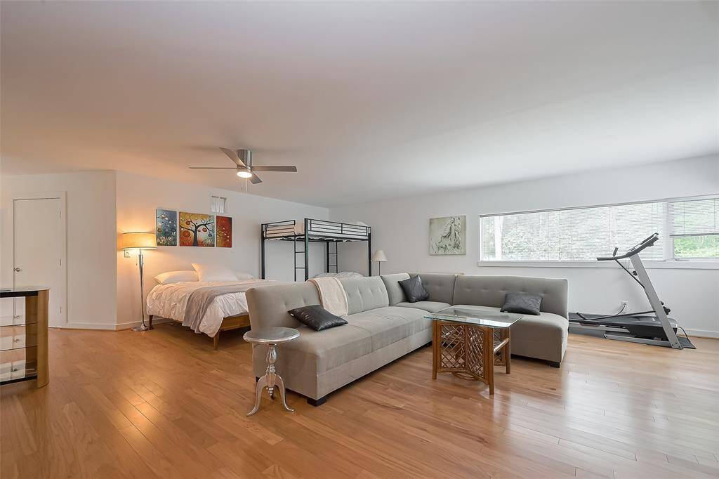 Relax in this expansive multi-use space with cozy sleeping quarters and a large sectional sofa.