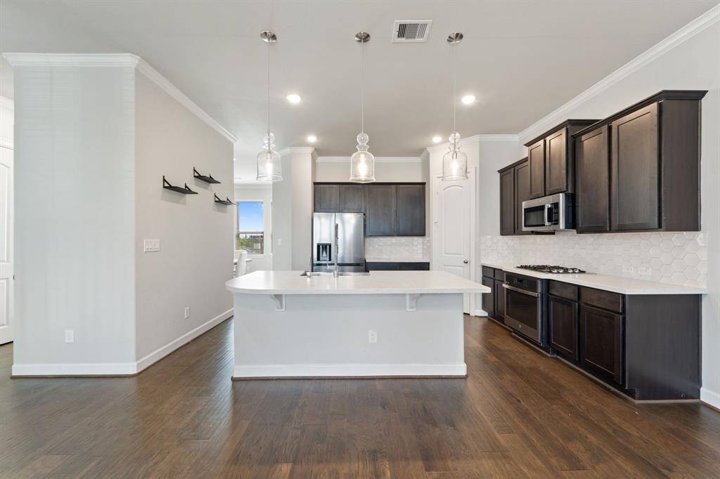 Breakfast bar makes for a relaxing place for guests to sit and chat while dinner is being prepped!