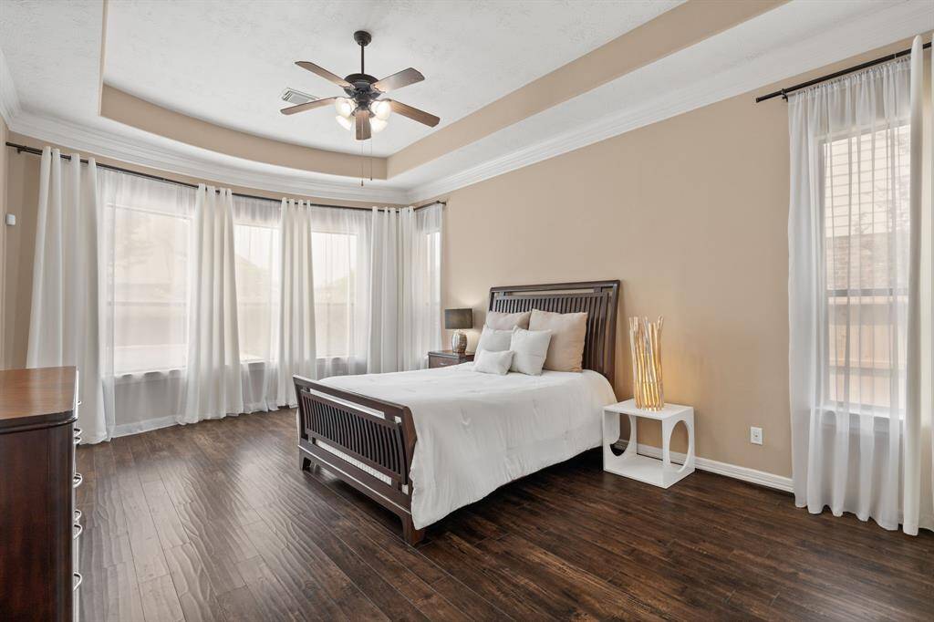Primary Bedroom with lots of light and overlooking the pool