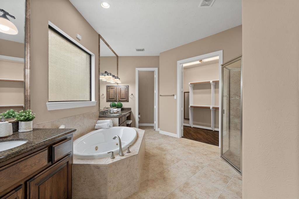 Primary bath with a shower and tub