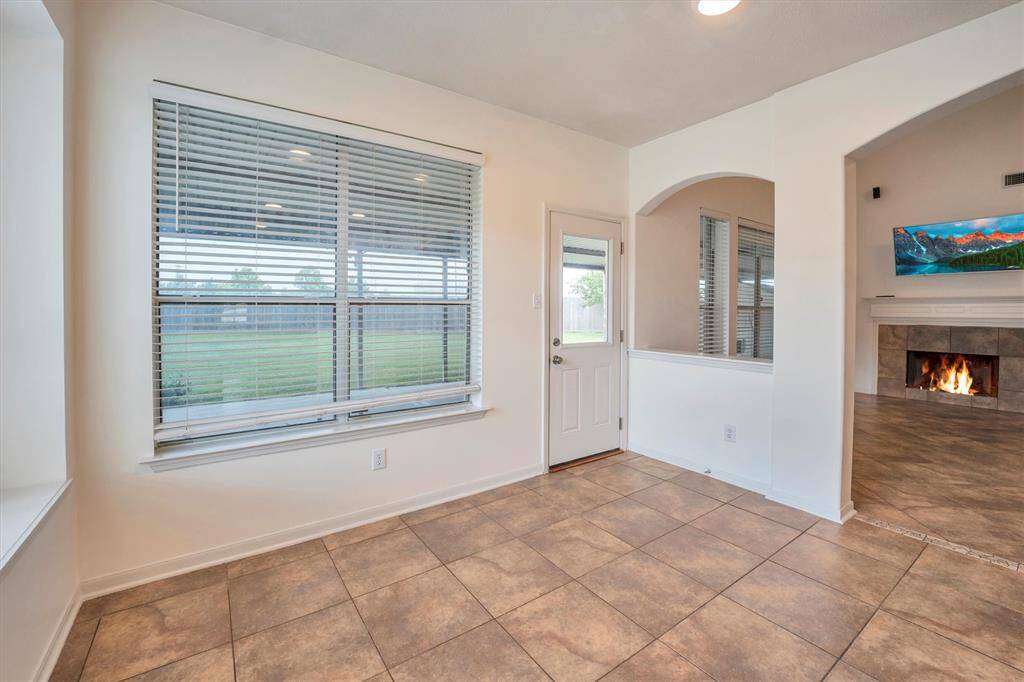 Enjoy casual meals or sip your morning coffee in the cozy eat-in dining area just off the kitchen—a perfect spot to start or end your day.