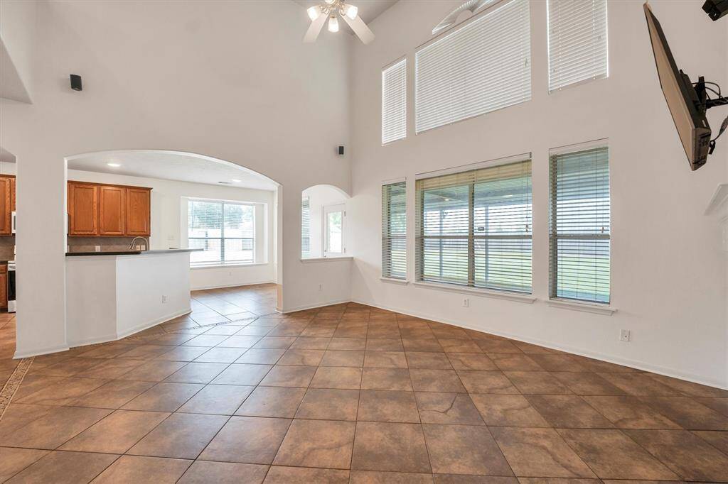 This inviting space is perfect for relaxing, whether you're enjoying a movie night or taking in the serene backyard view.