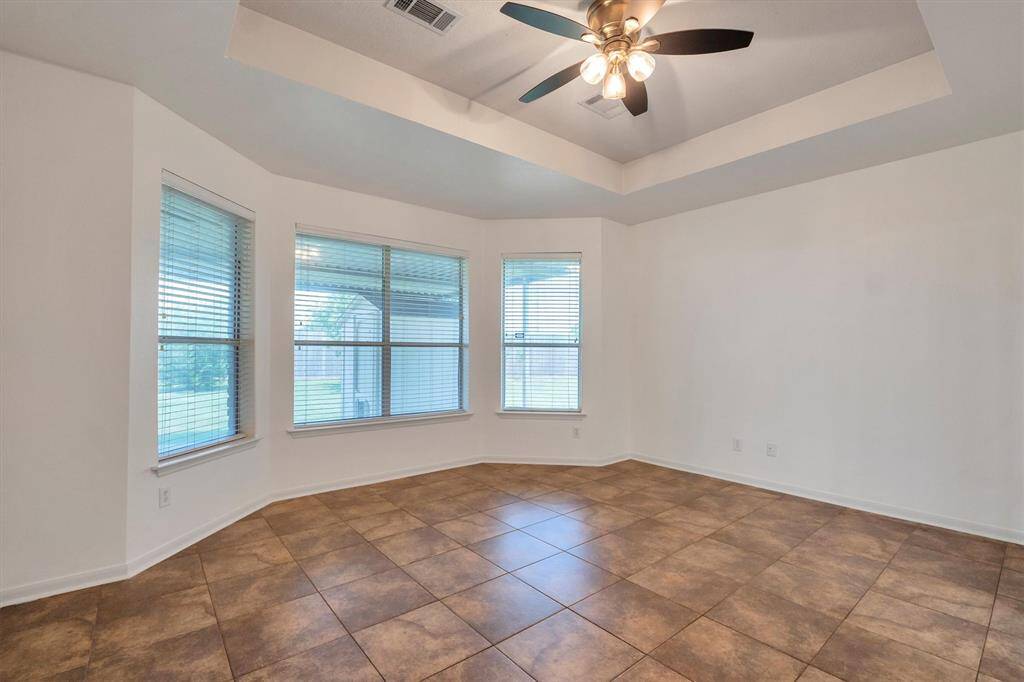 Spacious primary bedroom perfect for relaxation.