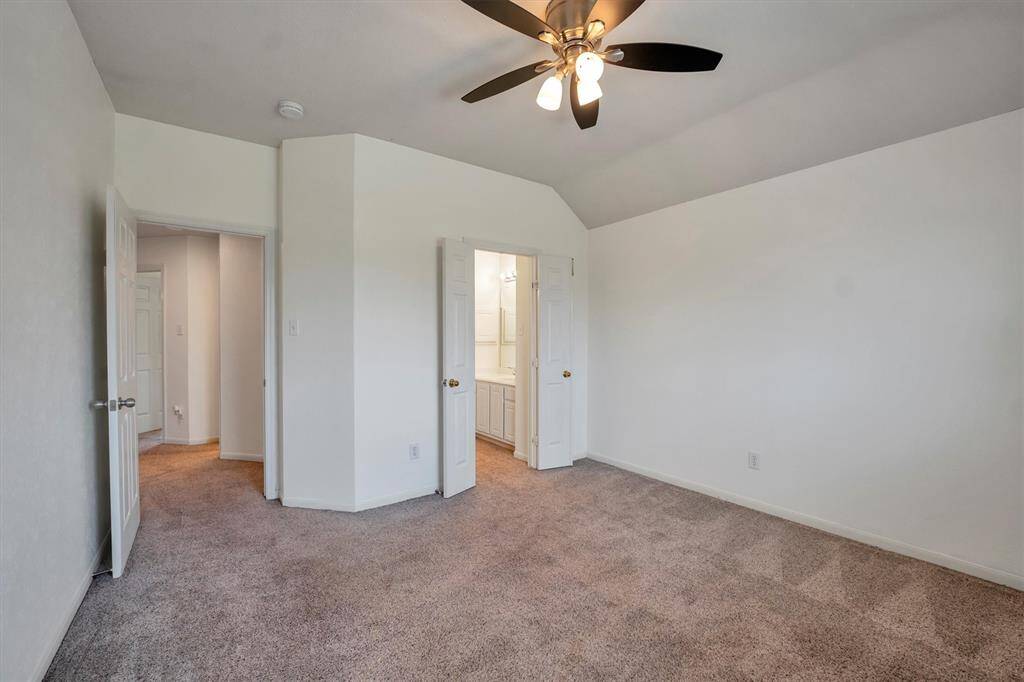 Another view of the upstairs secondary bedroom with a walk-in closet