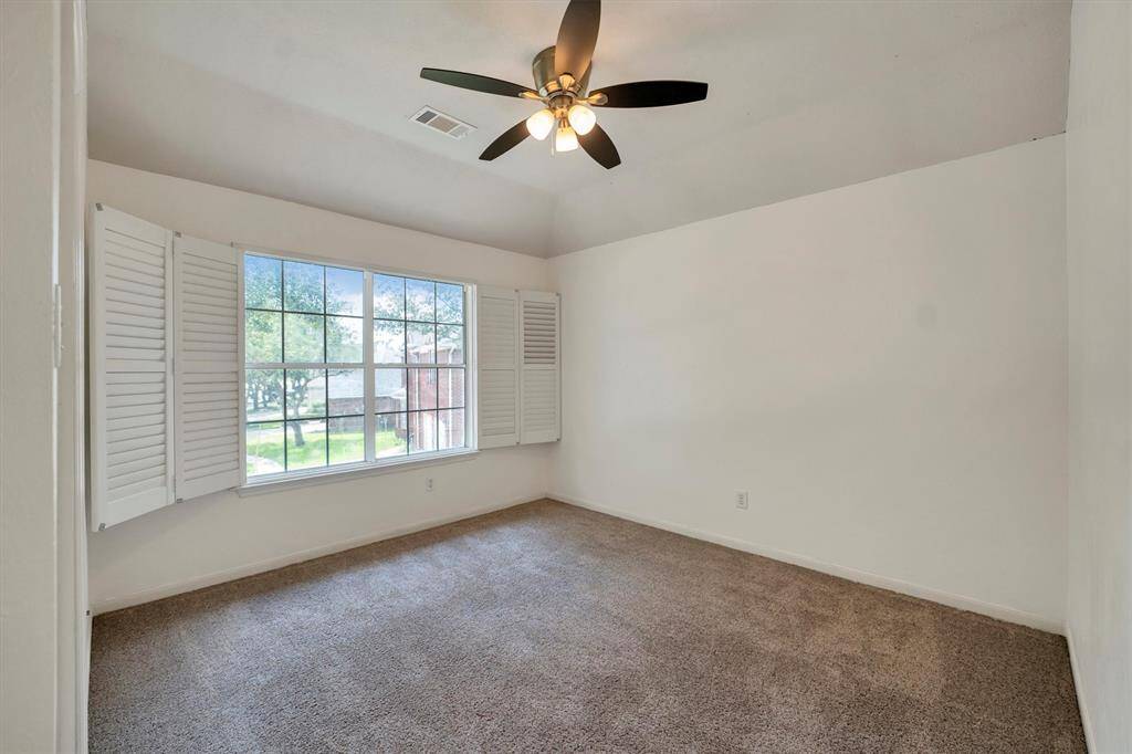 A third bedroom with plantation shutters