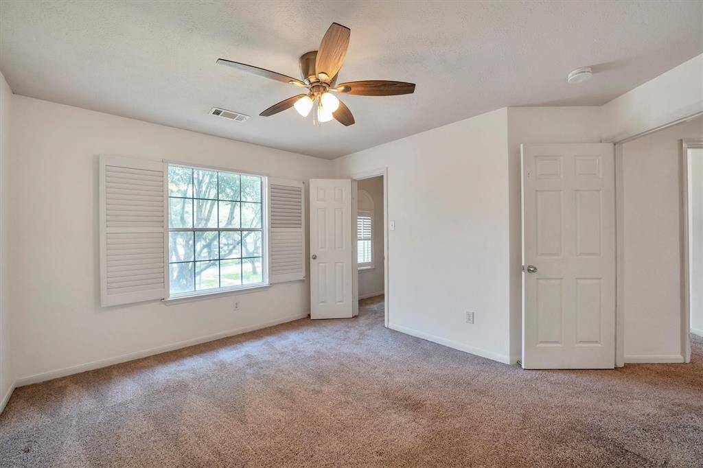 Another view of the upstairs fourth bedroom with a walk-in closet