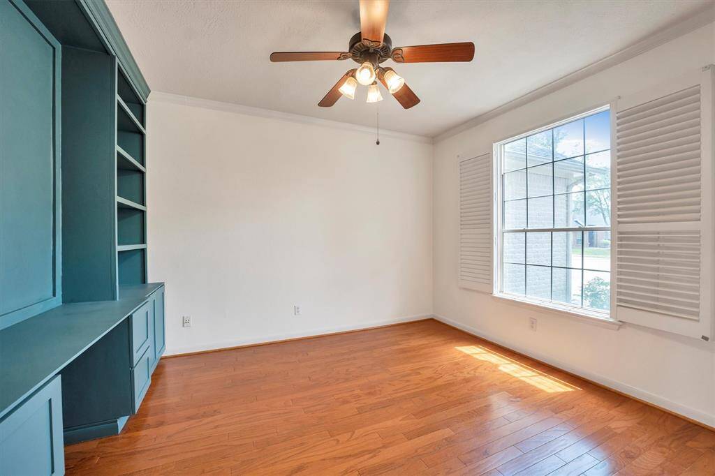 This versatile space combines functionality with style, perfect for a home office or creative retreat.