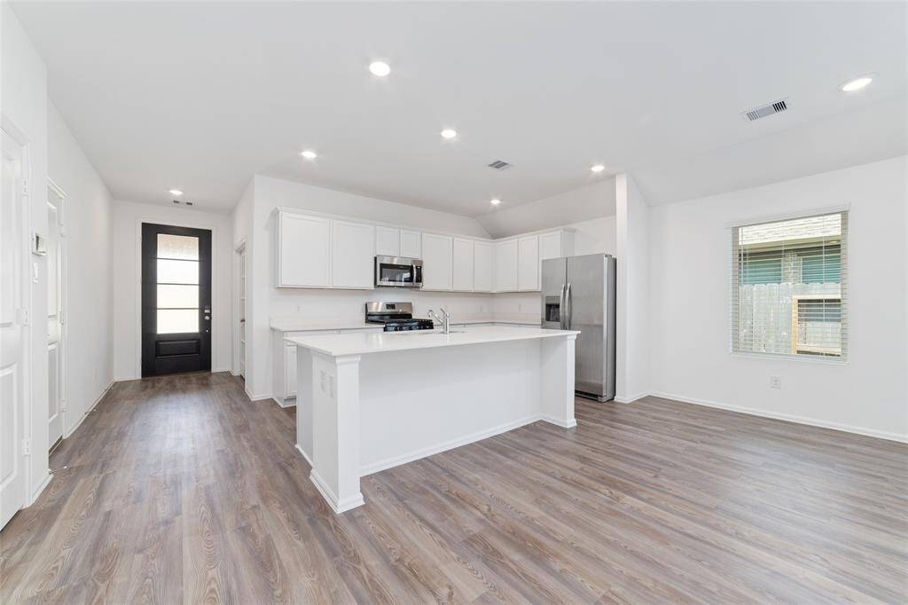A look at the dining space next to the kitchen. Room for stools under the island for extra seating.