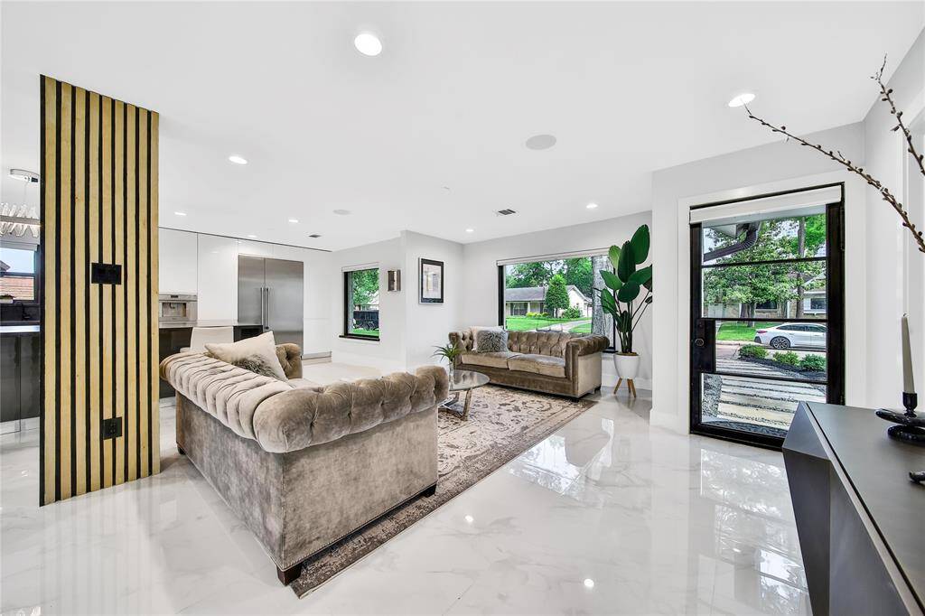 Beautiful formal living space with natural light streaming in.