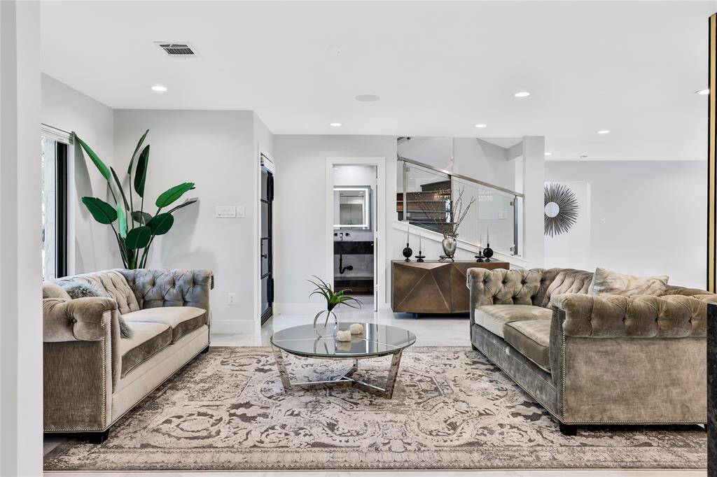 Beautiful formal living space with natural light streaming in.