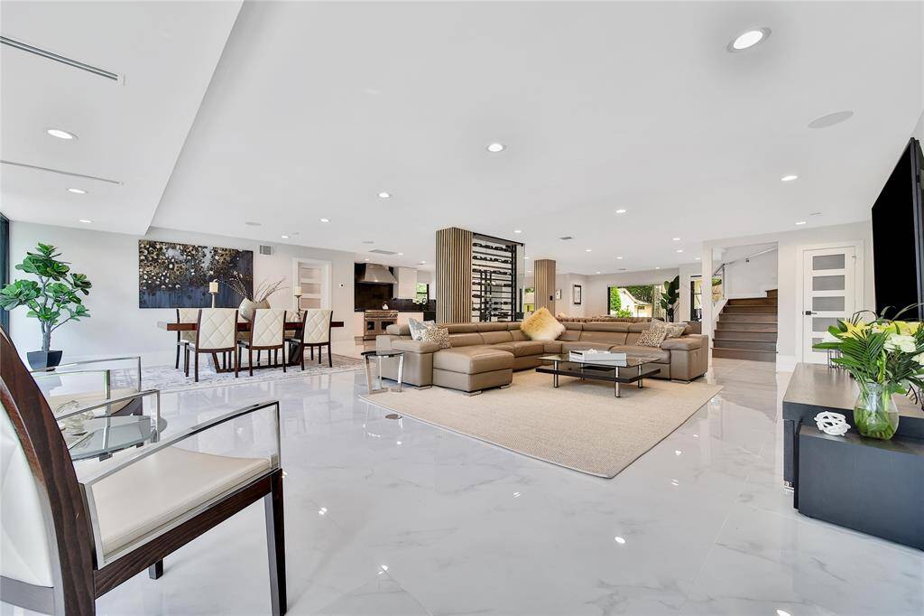 Spacious family room featuring wine cellar and backyard views.