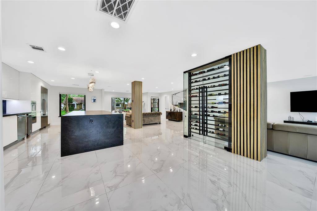 Welcome to open concept living with a beautiful wine cellar at the center.