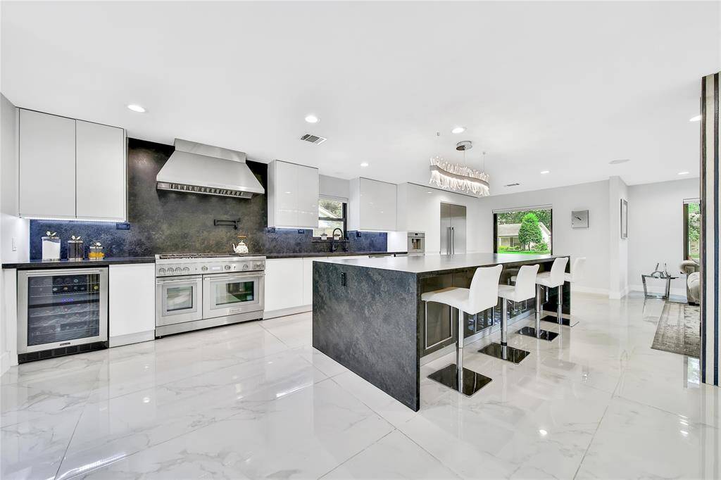 The kitchen features premium Thermador appliances, built in coffee maker, ice maker, soft close cabinets and drawers, pot filler, whole house water softener system, and more!