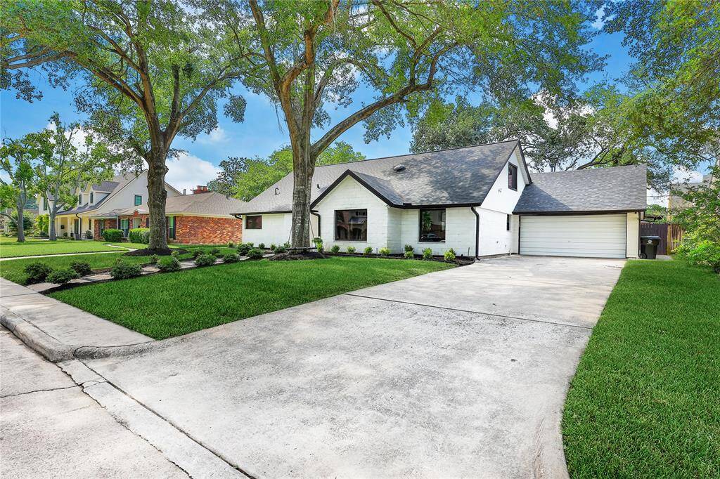 Private driveway with two car attached garage.
