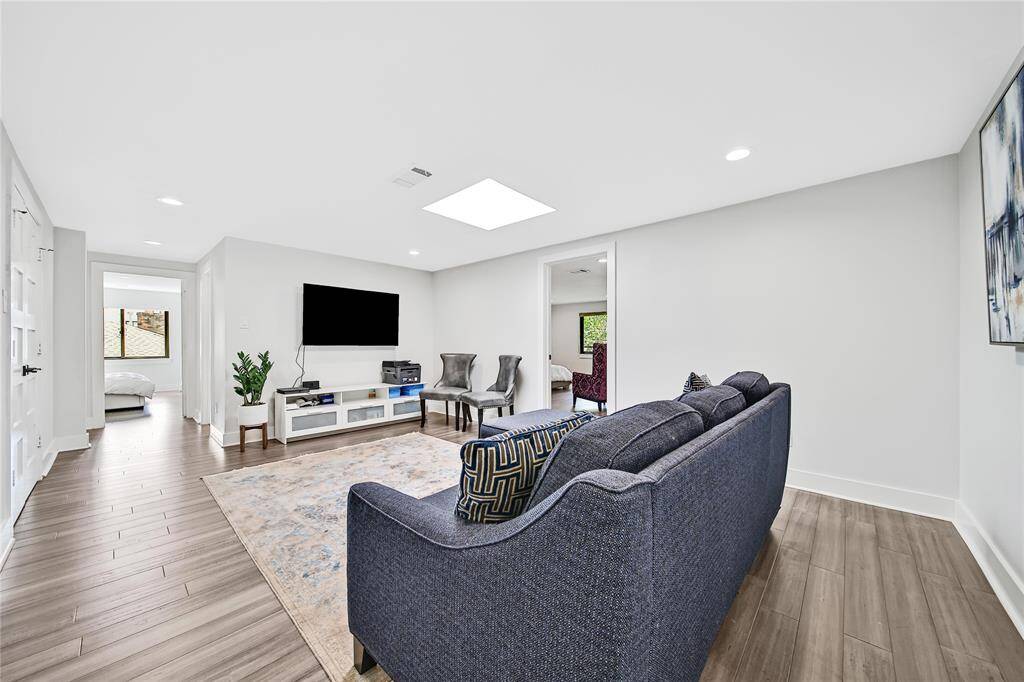 Beautiful upstairs primary bathroom with double sinks, soaking tub, glass shower with dual shower heads.