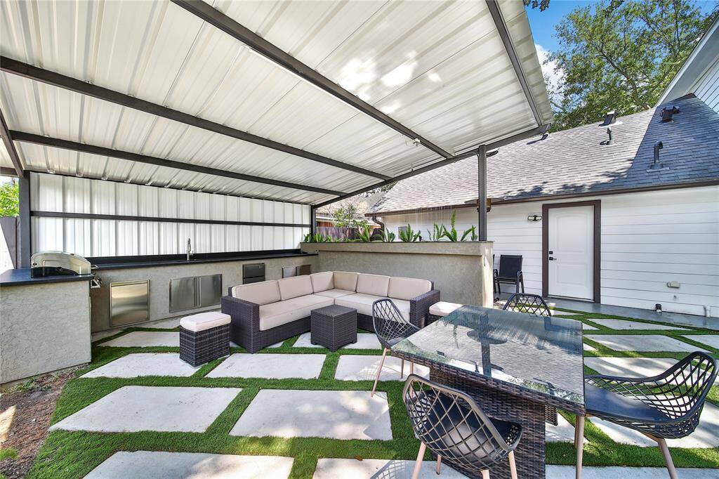 Beautiful backyard upgrades include fire pit, water features, outdoor kitchen, and more!