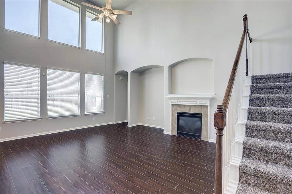 Living Room has Wall of Windows Allowing A Lot of Natural Light Into The Home
