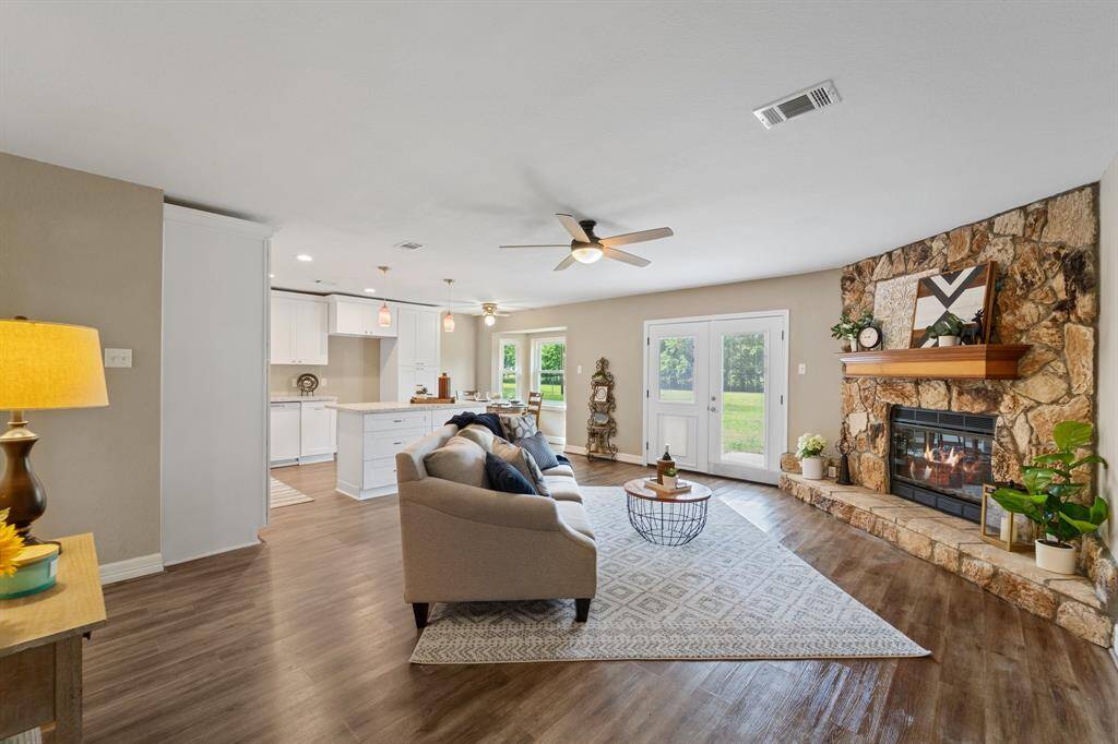 Bright dining nook bay windows show off the serene views, ideal for intimate gatherings.