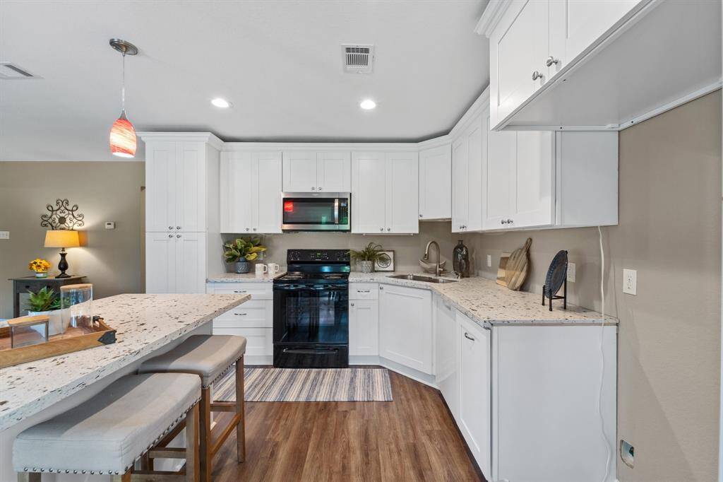 Spacious closet with built-in shelving and direct bathroom access for seamless convenience.