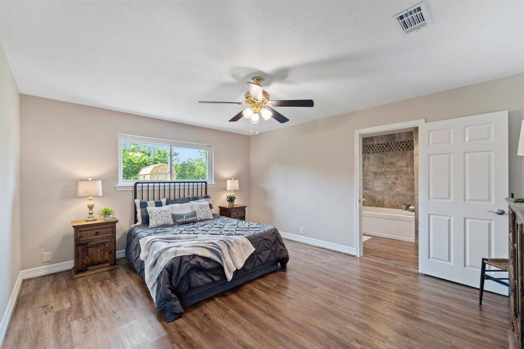 A welcoming hallway leads to two cozy bedrooms and a modern bathroom.
