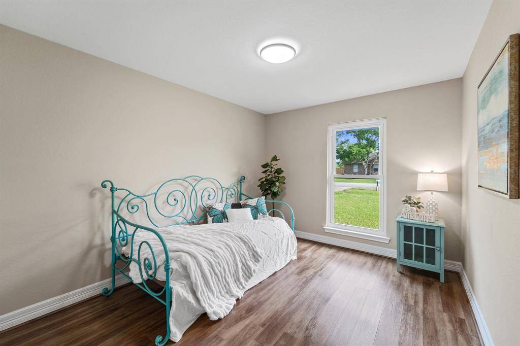 Fenced backyard offering privacy and ample space for outdoor activities.
