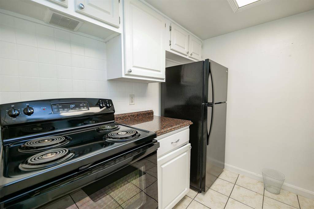 The kitchen is equipped with black appliances!