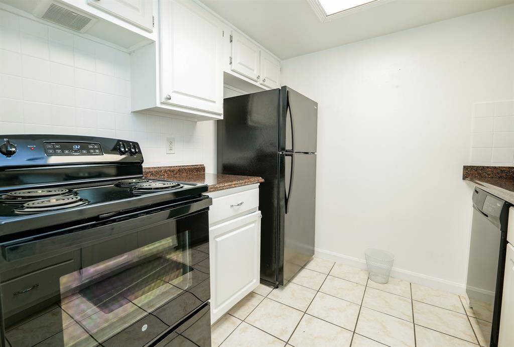 Another view of the well-lit kitchen!