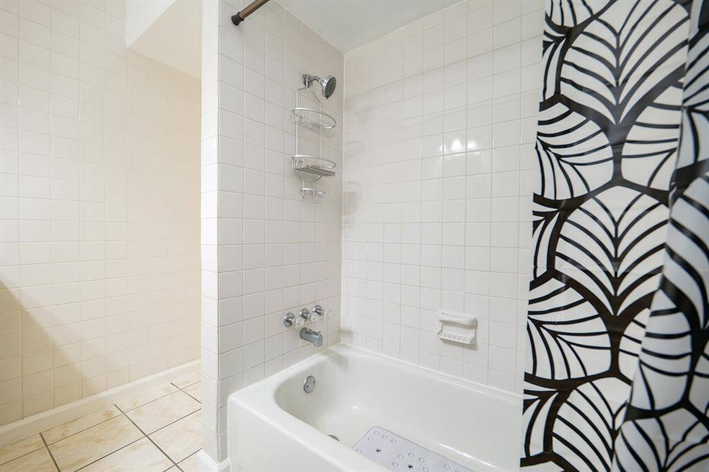 Tiled shower/tub combo in the bathroom!
