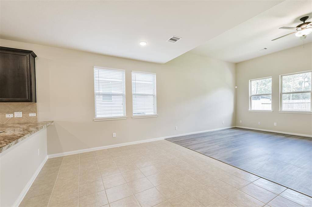 Flooring Delineates the Dining from the Living Area - Creating Separate Spaces to Match the Ceiling Detail!