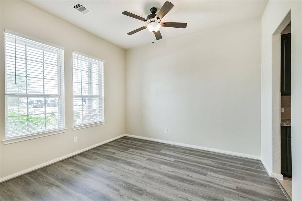 Formal Dining Room in Front Portion of the Home - Kitchen Door to the Right!