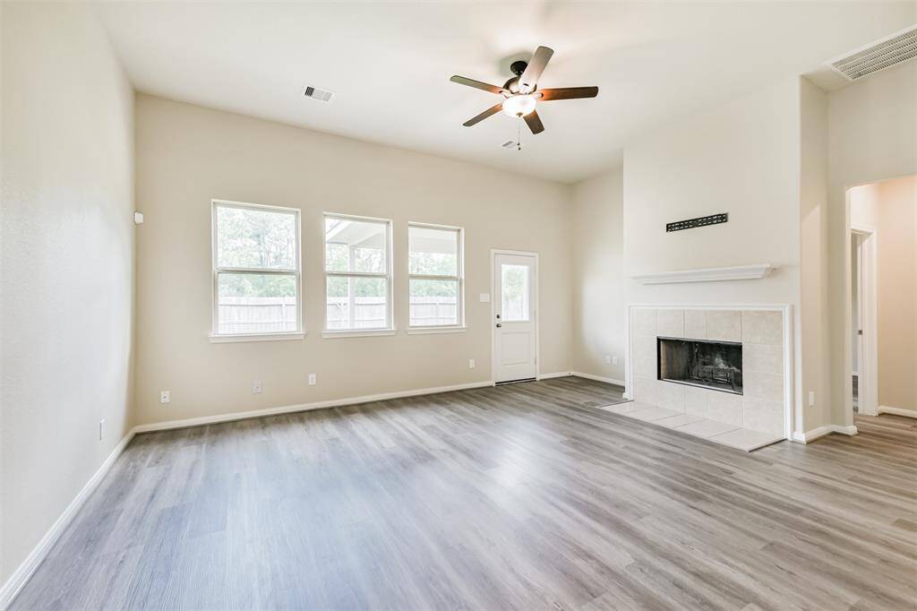 The Large Living Area is Bright with Lots of Natural Light! Check Out This Working Fireplace for Those Romantic Winter Nights!
