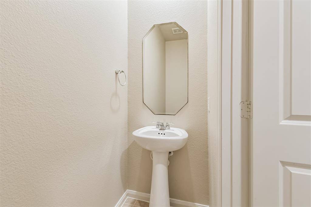 A First Floor Powder Room Keeps Visitors Out of Your Personal Bedroom Space in the Downstairs Primary Bathroom!
