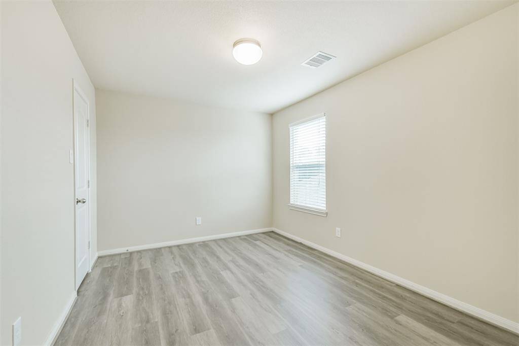 One of the Upstairs Bedrooms with New Vinyl Flooring!