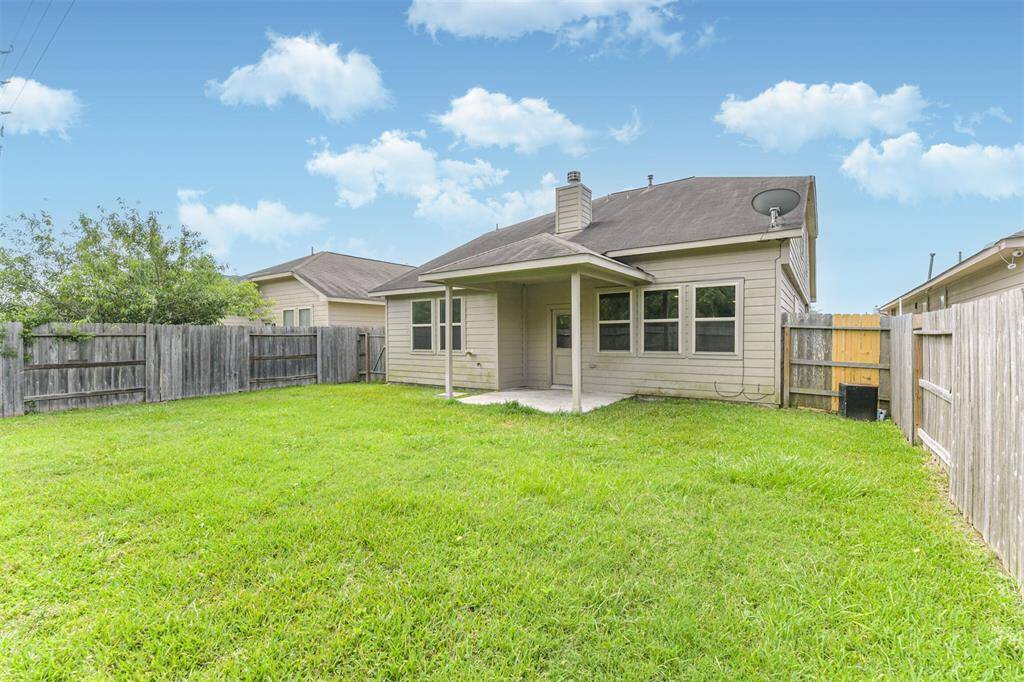Another Perspective Showing the Lush Lawn! Note the Large Window Ensuring Lots of Light to Make the Home Bright and Airy!
