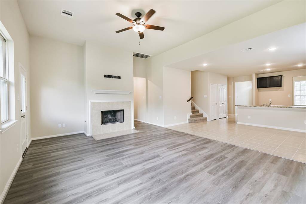 This View Shows the Living Room and Dining Room Combo. An Open Kitchen Design with Sight-Lines Means No One is Left Out While the Party's in Full Swing!